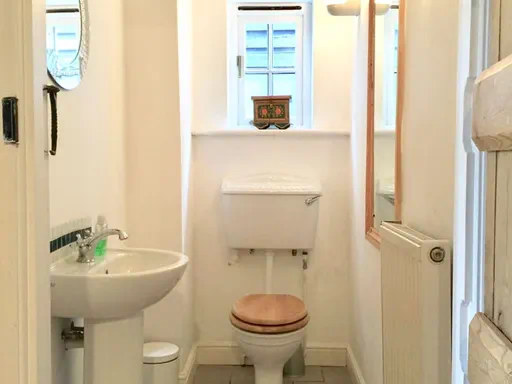 The Farmhouse Outside and Living spaces