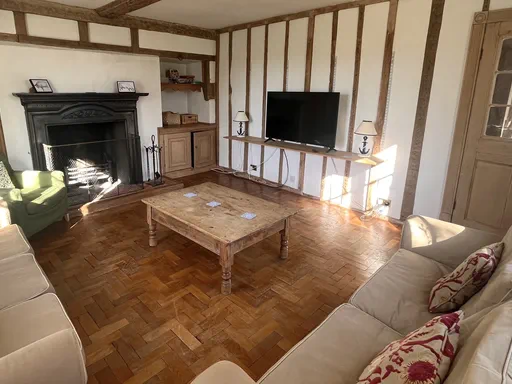 The Farmhouse Outside and Living spaces