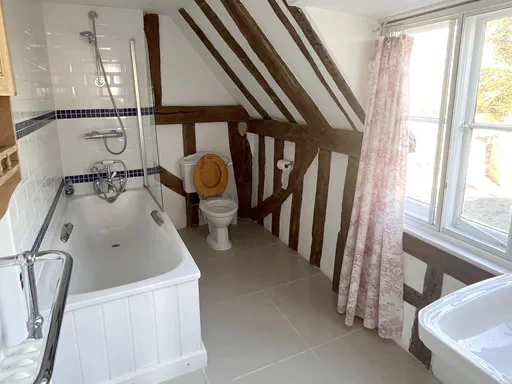 The Farmhouse Outside and Living spaces